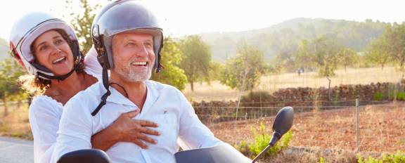 Couple riding motorcycle