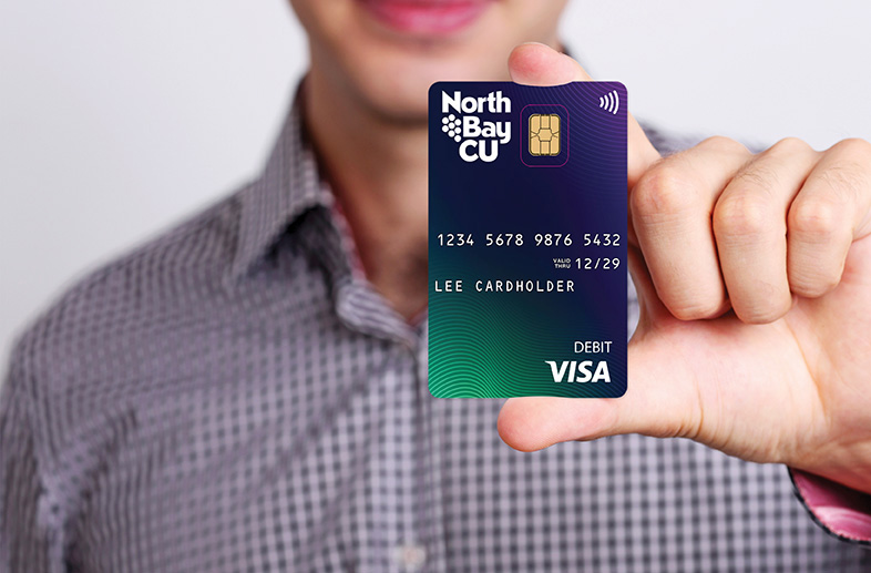 Man holding North Bay CU debit card