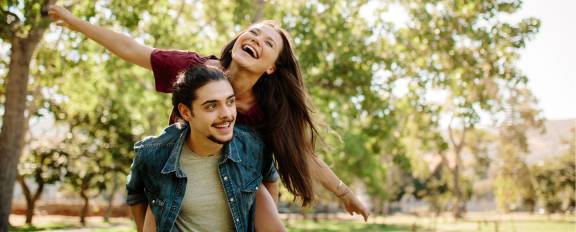 Couple outdoors under trees
